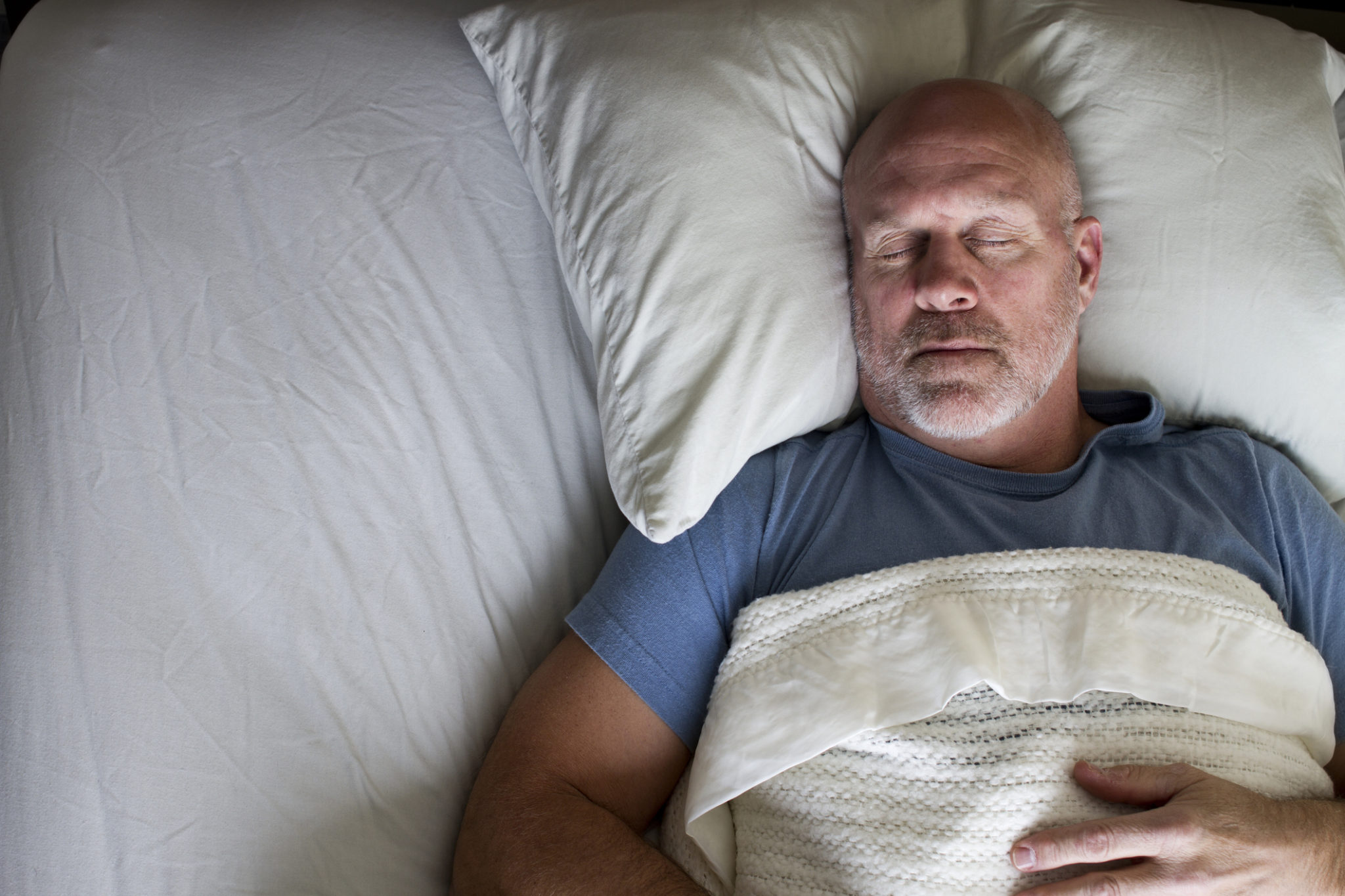 Man Sleeping in Bed